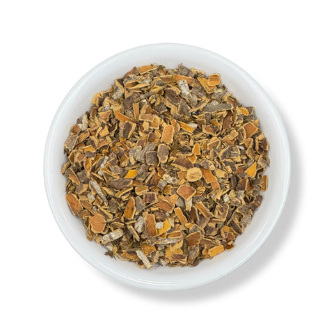 A bowl filled with cut and sifted Cascara Sagrada, a natural herbal product used for digestive health.