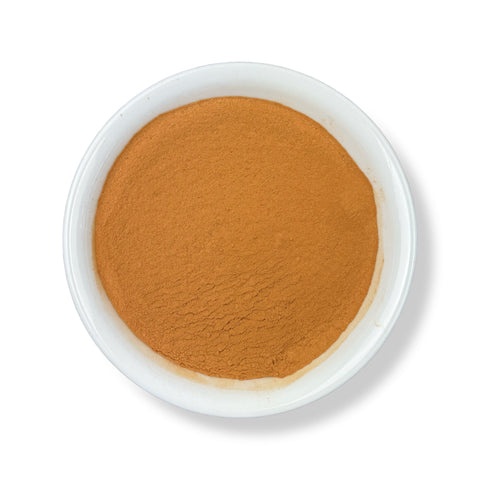 A bowl of Cinchona Bark Powder on a white background.