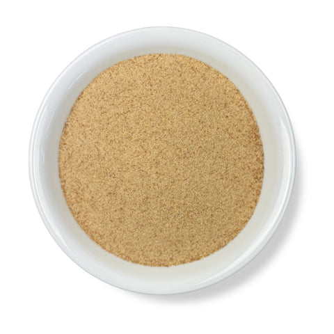 A bowl of Psyllium Husk Powder against a white background.