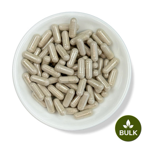 A white plate filled with brown capsules, with a 'BULK' label at the bottom right corner.