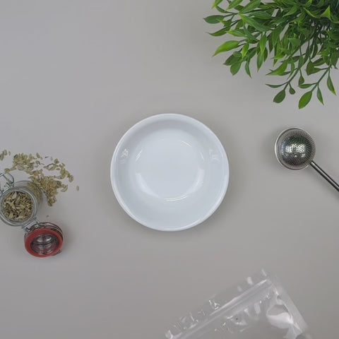Video of Evergreen Herbs dried red rose buds being displayed in a pouch and poured out into a bowl