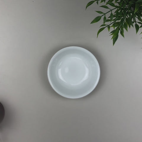Video of a pouch of Palo Guaco being poured into a white bowl.