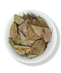 A bowl filled with dried avocado leaves.