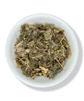 A bowl of dried Blessed Thistle (Cnicus benedictus) herb, with a prickly appearance, against a white background.