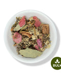 A variety of dried herbs and plants in a white bowl, labeled 'BULK' on a green badge, indicating the product is sold in bulk.