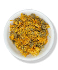 A bowl of dried calendula flowers with vibrant golden petals and brownish-green calyxes against a white background.