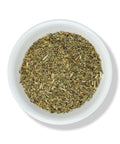 Dried cut catnip herb in a white bowl.