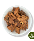 A white bowl filled with dried Cocolmeca Bark root pieces, with a 'BULK' label in the lower right corner.