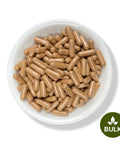 A white bowl filled with brown capsules, each capsule is marked with an imprint, and there is a 'BULK' label on the image.