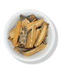 Dried copalquin bark pieces in a white bowl on a white background.