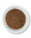 A bowl filled with cut and sifted brown cornsilk, also known as Pelo De Elote, on a white background.