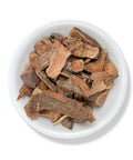 A bowl containing dried pieces of Cuachalalate bark, an herbal remedy from Mexico.