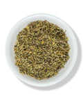 A white bowl filled with dried Damiana leaf, against a white background.