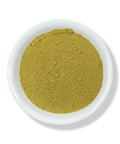 A white bowl filled with green Damiana Leaf Powder on a white background.
