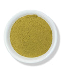 A white bowl filled with ground Damiana leaf, against a white background.