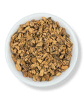 Cut and dried Gentian Root pieces in a white bowl