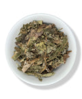 A bowl filled with dried leaves, resembling Guarumbo, a natural product used for health support.