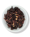 A plate of dried hibiscus flowers, typically used for making tea or in culinary dishes.