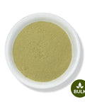 A white bowl filled with Nettle Powder on a white background. 