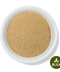 A bowl of Psyllium Husk Powder, with a green logo indicating the product is sold in bulk.