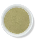 A bowl of green Muicle powder.