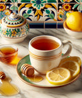 Cup of herbal tea with lemon slices and honey on a marble countertop, in front of colorful decorative tiles.