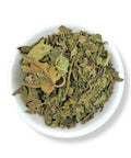 Dried Ficus carica (fig) leaves from Mexico displayed in a white bowl. 