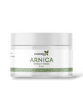 A jar of Evergreen Arnica Extract Cream with a white and green label, indicating it is a skin care product.