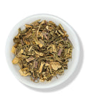A white bowl filled with dried marshmallow herb leaves and stems.