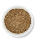 A bowl filled with fine-cut Mandrake root, a herbal product used for its mystical and traditional properties.