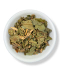 A bowl filled with dried loquat leaves.