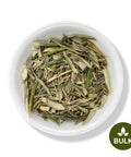 A white bowl filled with dried olive leaves, with a 'BULK' label at the bottom right corner.