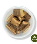 A bowl of dried Eysenhardtia polystachya, also known as Palo Azul, kidney-shaped herb pieces.