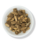 A bowl of dried Mikania glomerata roots, also known as Palo Guaco, against a white background.
