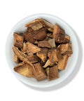 A bowl containing dried pieces of Palo Mulato (Bursera simaruba) bark.