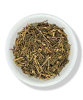 A bowl of dried Pericon (Santa Maria) herb leaves.
