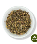 A white bowl filled with dried Pericon (Santa Maria) leaves and stems, indicating the bulk herb offering.