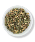 Dried Pennyroyal herb (Poleo) pieces in a white bowl.