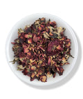 A bowl filled with dried red rose buds.