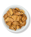 Dried Semilla de Zopilote pieces in a white bowl.