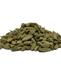 A heap of cardamom pods on a white background