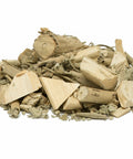 Loose dried Malabar herb pieces, showing light tan wood-like chunks on a white background, used for traditional wellness preparations and herbal teas.