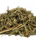 Dried passion flower herb pieces in a loose pile on a white background.