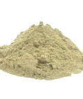 Mound of light tan yucca powder on a white surface.